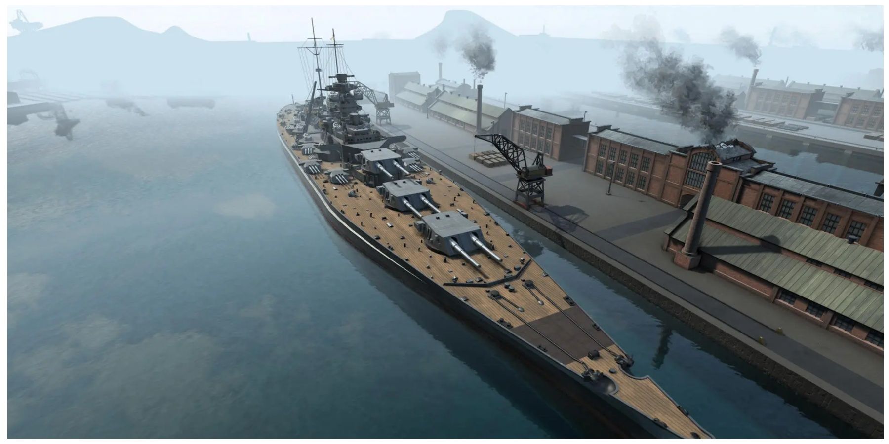 A huge warship waiting at a dock