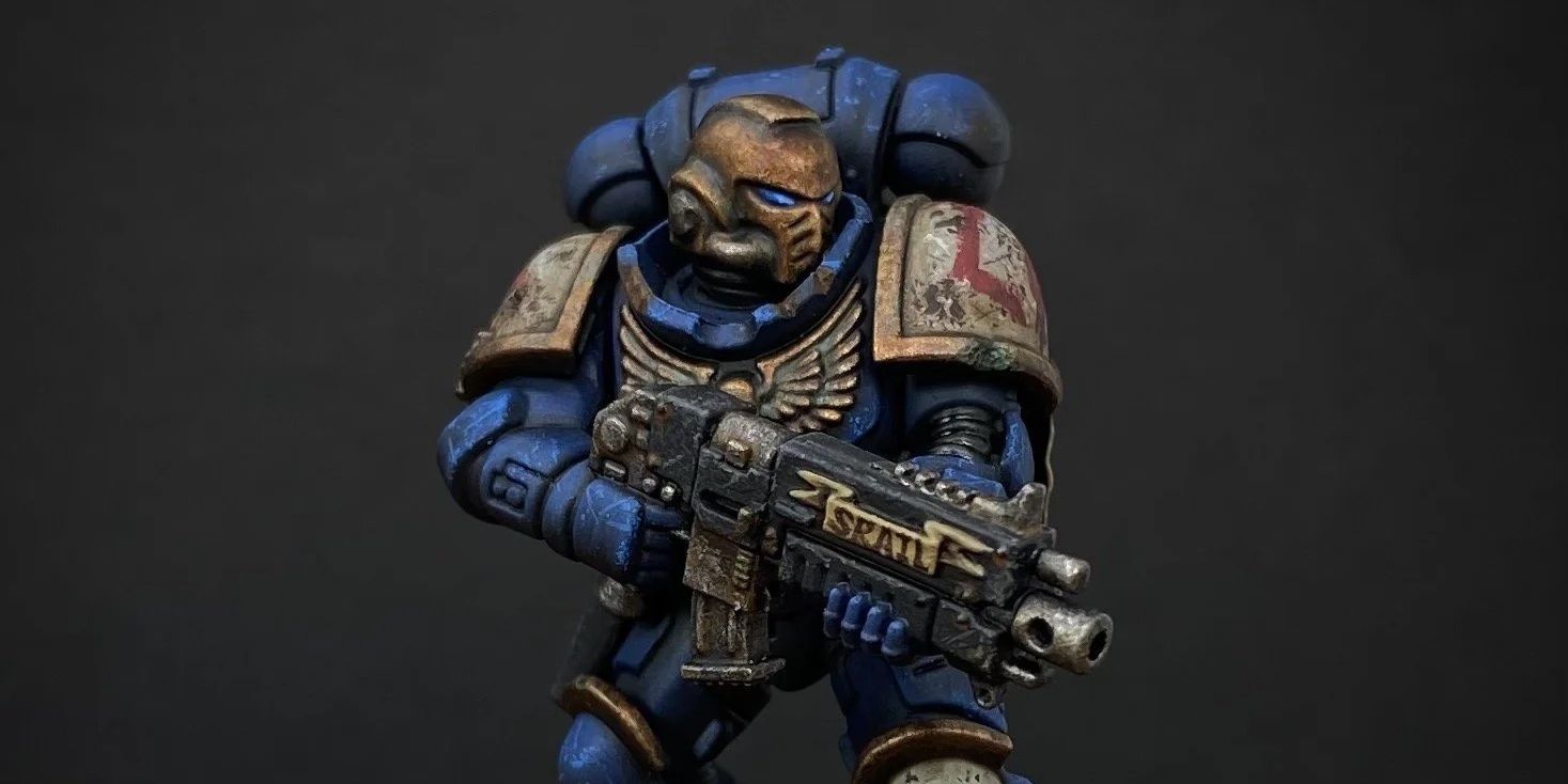 A Void Tridents Space Marine miniature, holding a bolter 