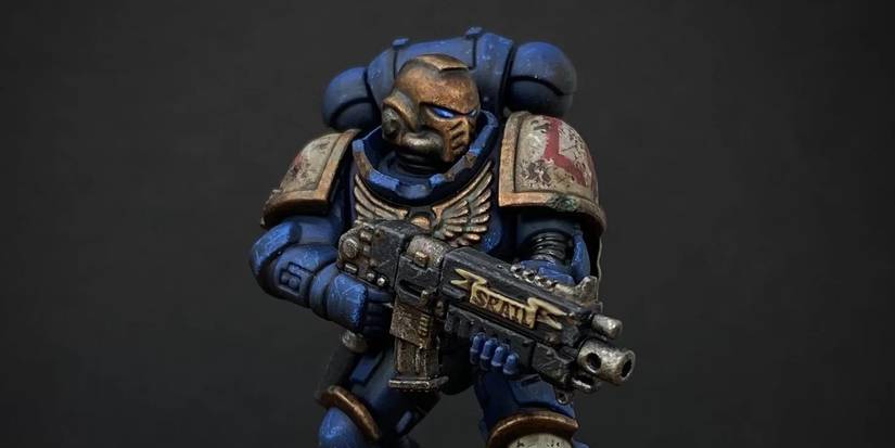 A Void Tridents Space Marine miniature, holding a bolter  