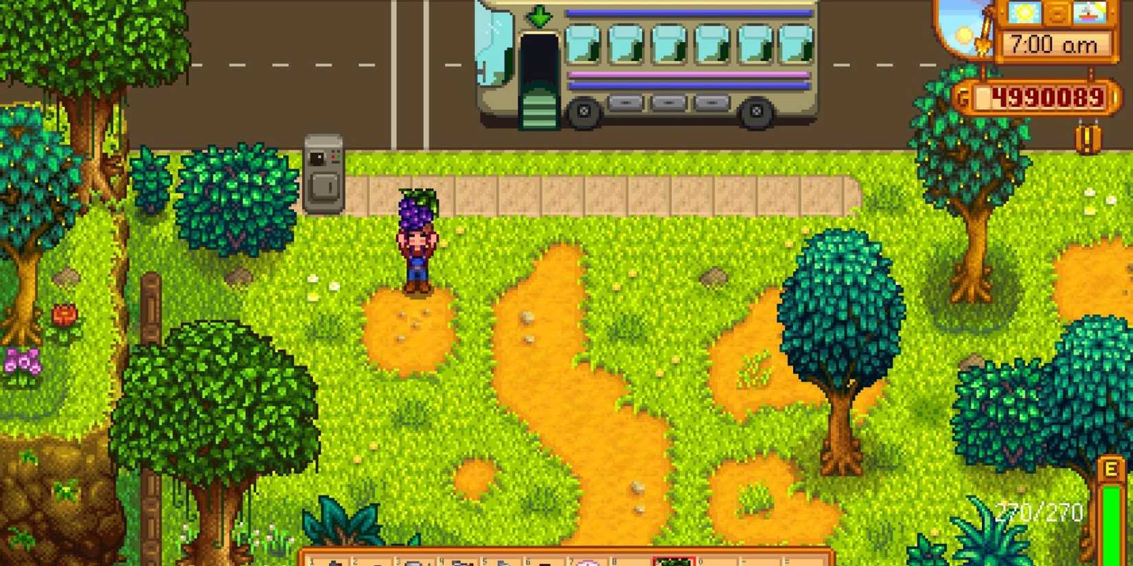 a player holding grapes in stardew valley