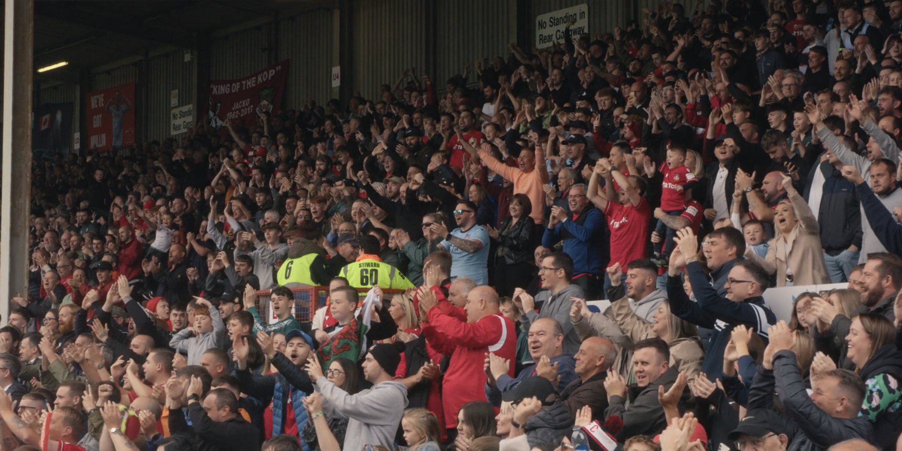 Wrexham AFC crowd in stand in Welcome to Wrexham season 2 episode.