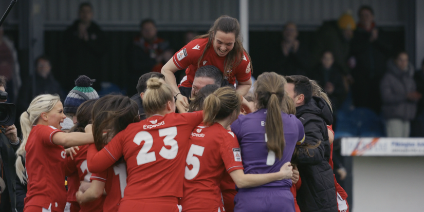 Wrexham women's team celebrating league win.