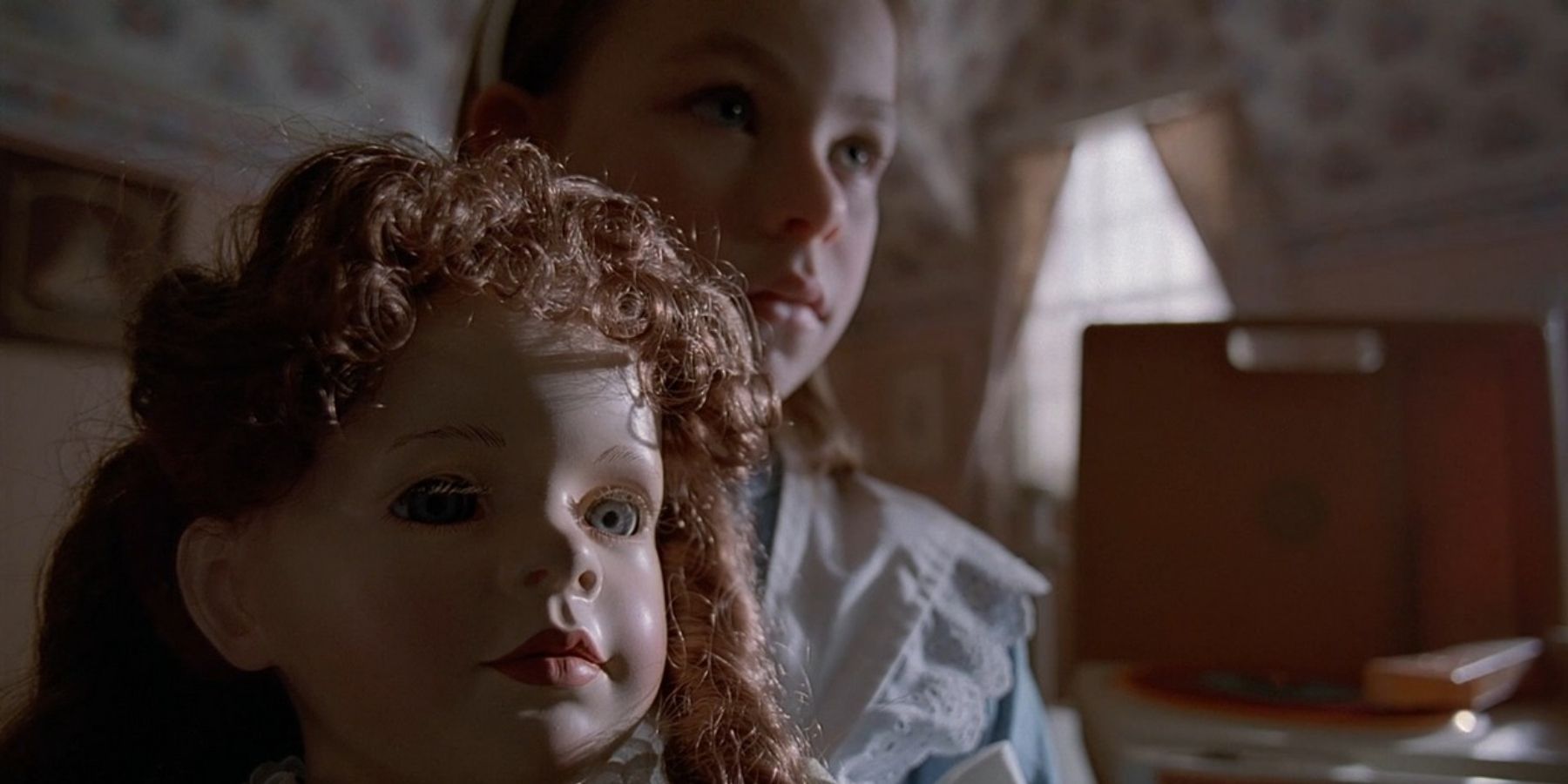 A young girl holding a doll in The X-Files episode "Chinga"