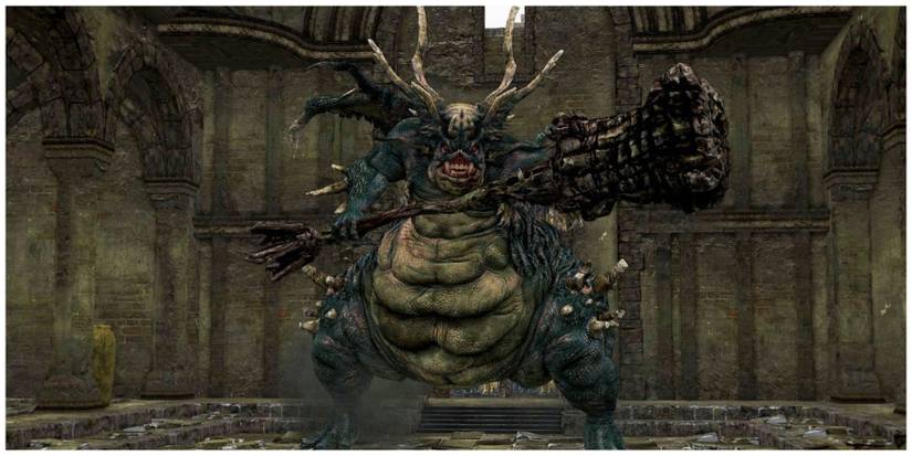 A huge green reptile-like monster holding a large weapon