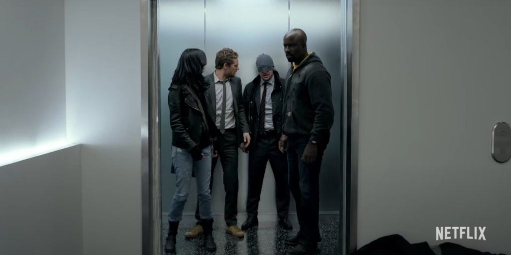 Daredevil, Jessica Jones, Luke Cage and Iron Fist coming out of the elevator