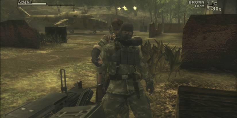 Metal gear solid 3 Snake holding a guard with stars over his head