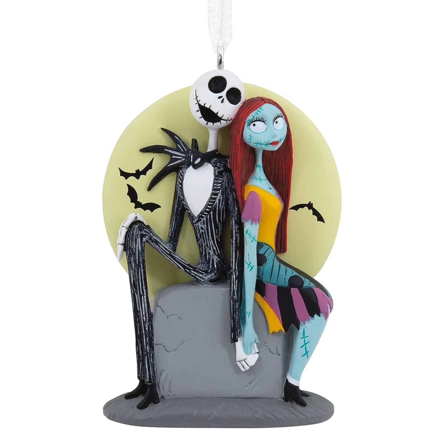 This ornament features Jack and Sally sitting on a grave holding hands