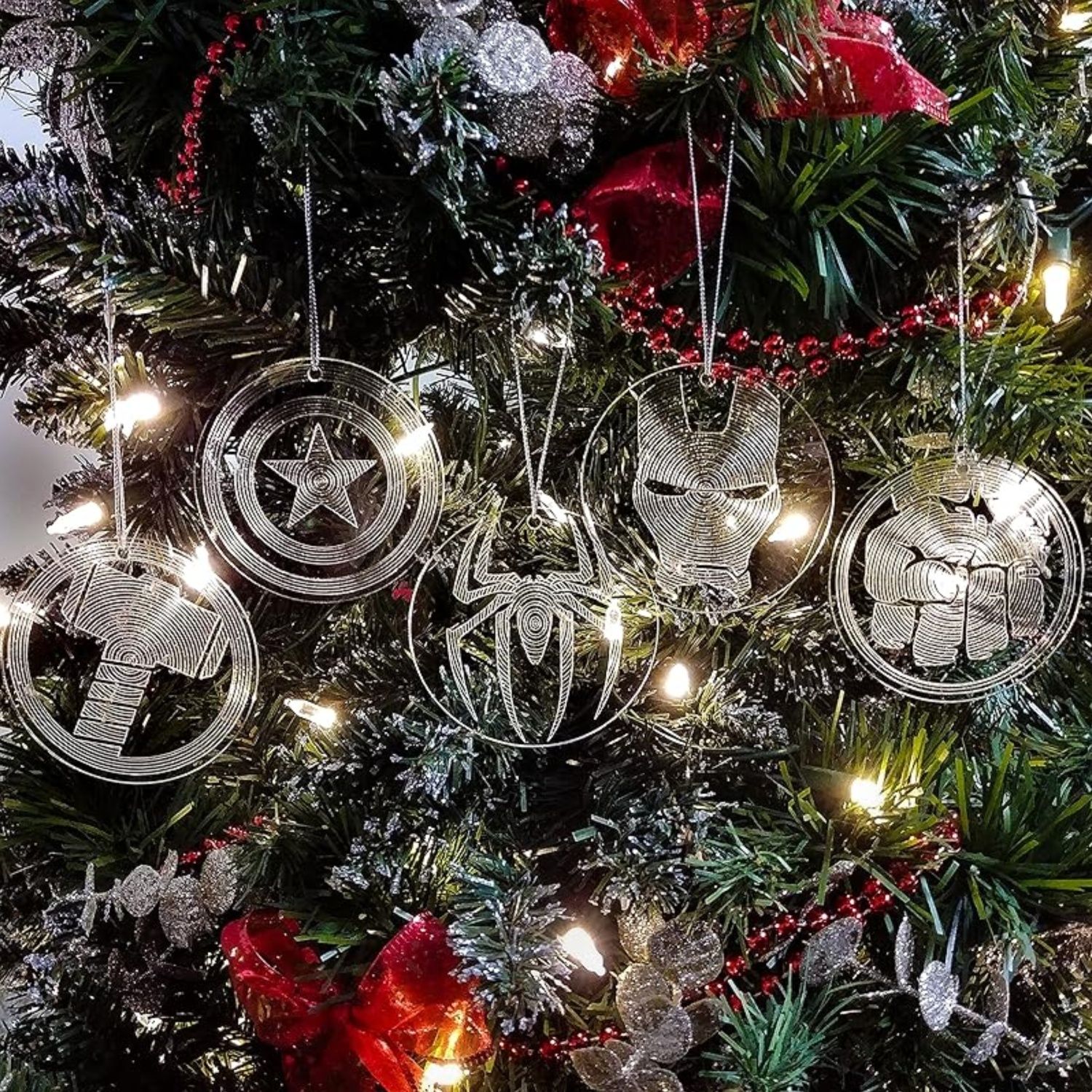 This image features five clear ornaments with the Avengers' symbols lasered on them.