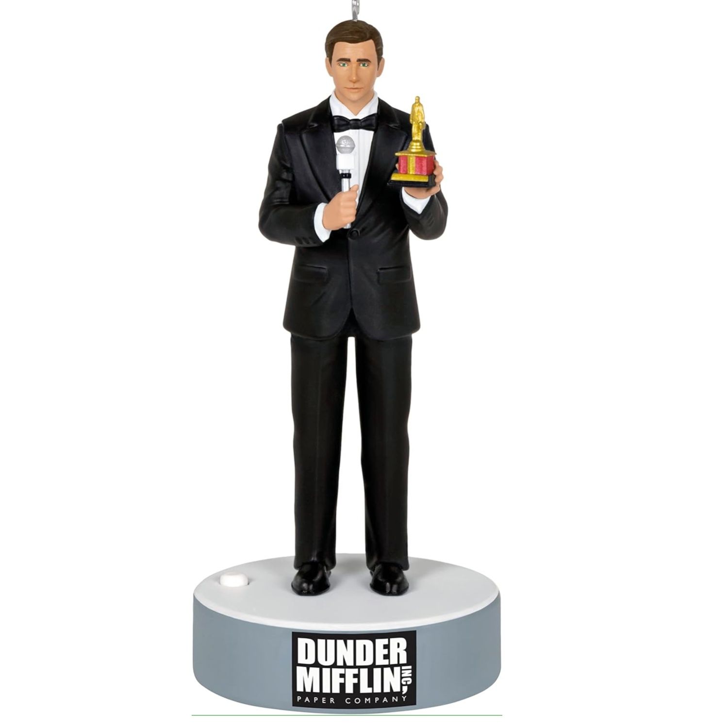 This image depicts a Michael Scott figurine where he is holding a Dundie award
