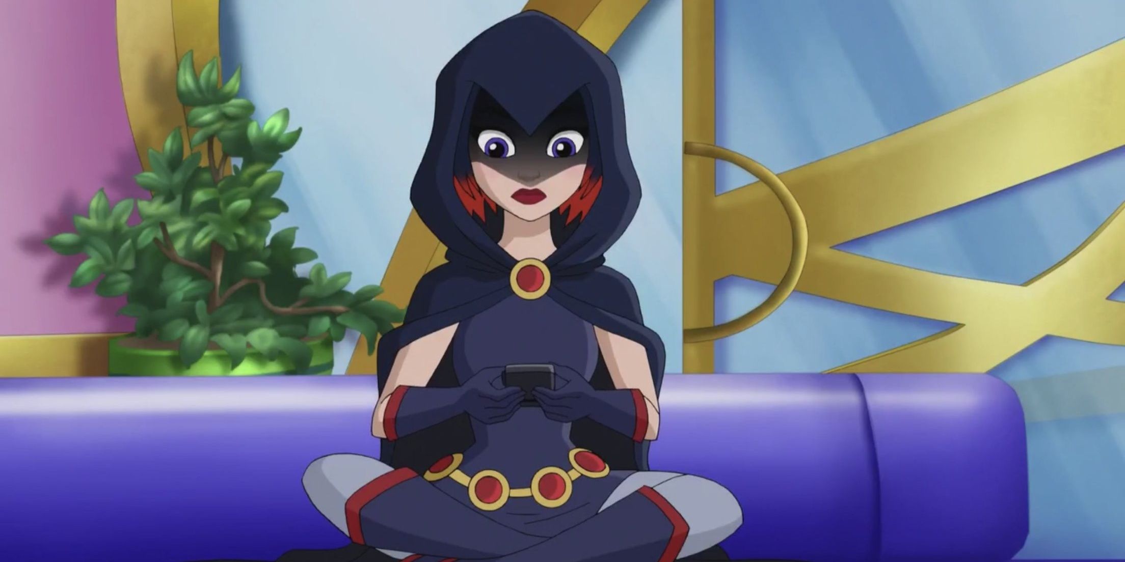 An image of Raven sitting down on the floor