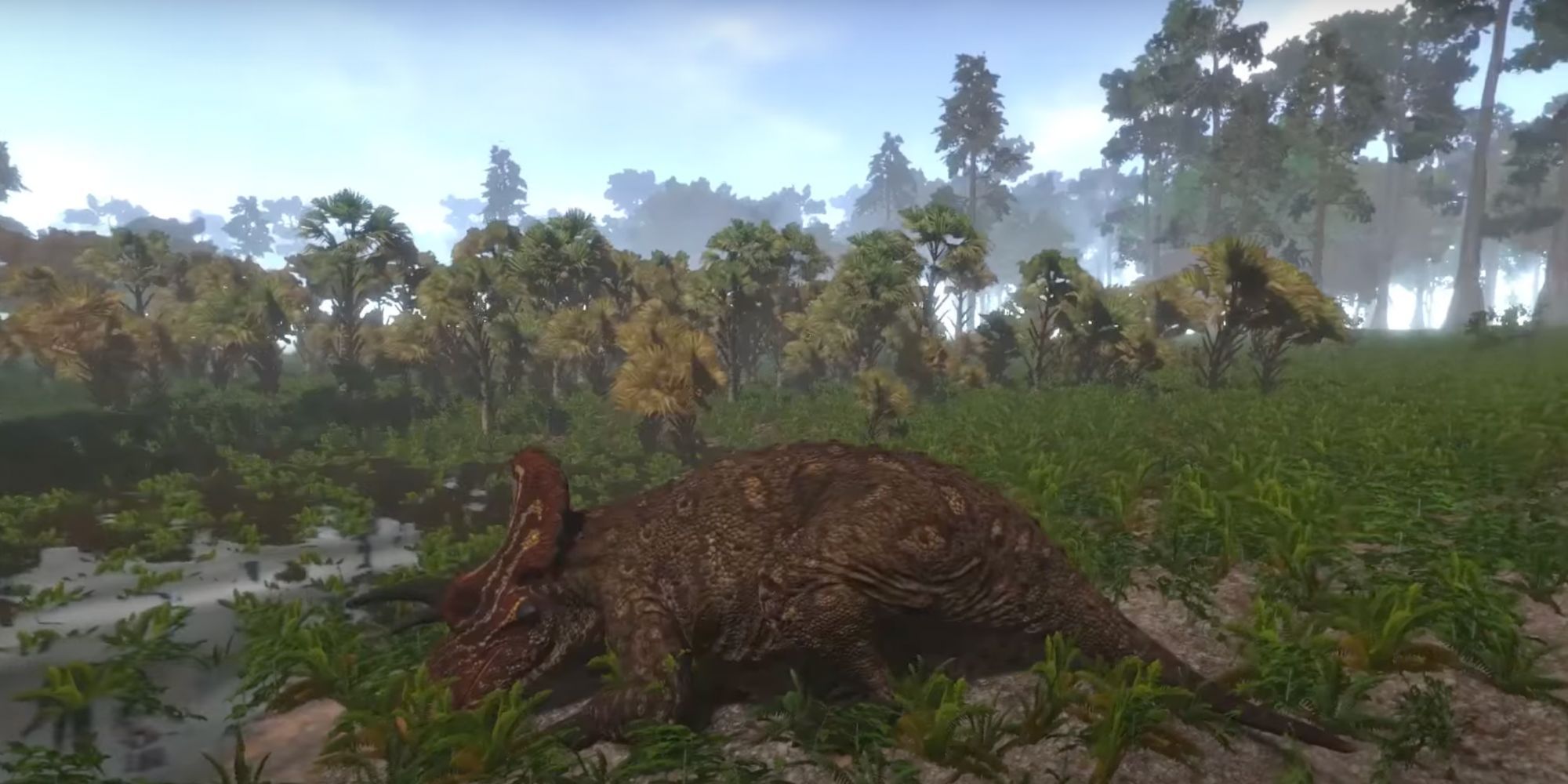 Image of a dinosaur from Saurian, sleep in a patch of grass
