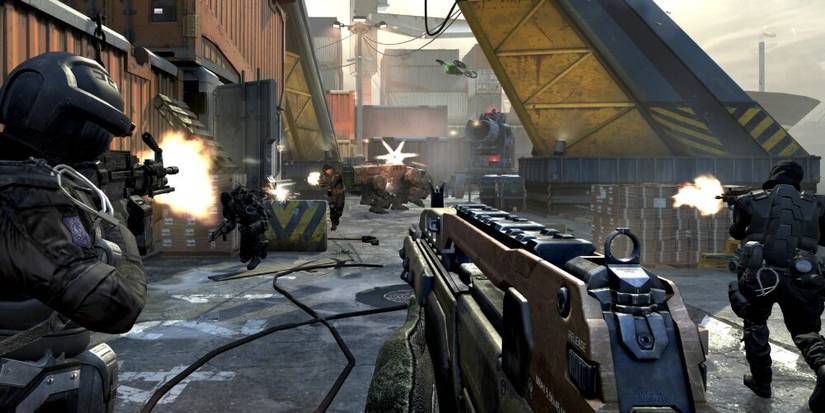 Soldiers firing at each other in a scrapyard