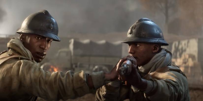 Soldier stopping his friend from firing at an enemy in Battlefield 5