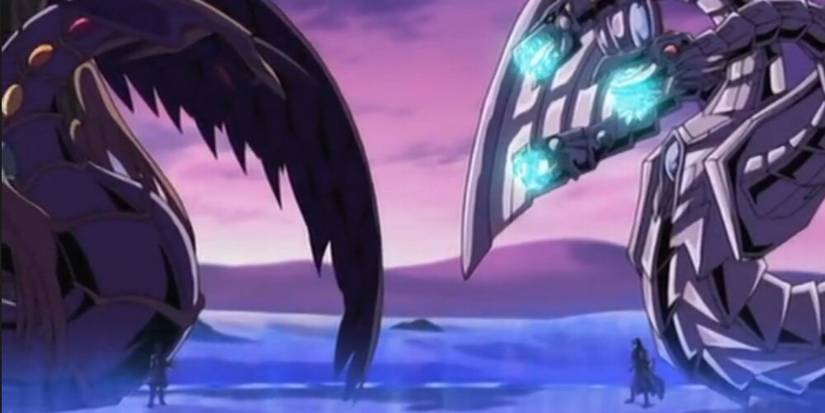 Zane and Yubel duelling with their dragons on the field 