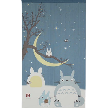 A long tapestry with Totoro creatures against a night sky