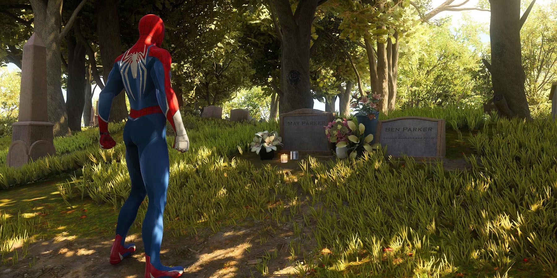 A screenshot of Peter Parker visiting the graves of his aunt and uncle in Marvel's Spider-Man 2.