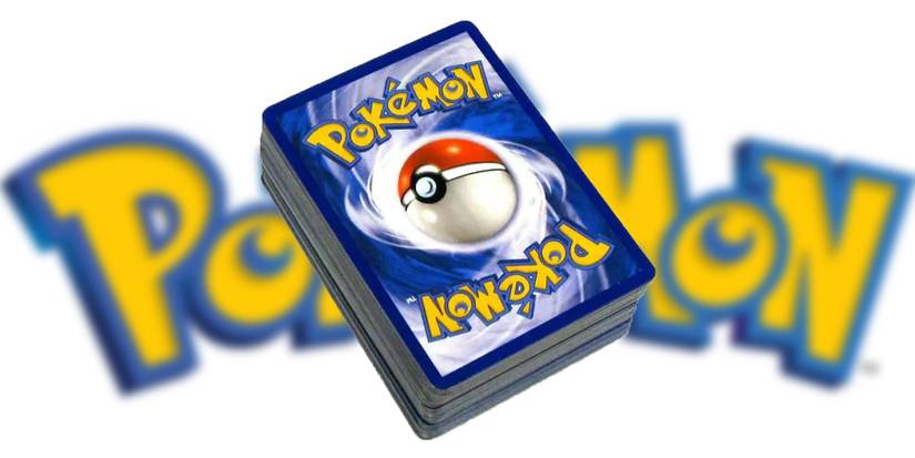 Stack of Pokemon cards over blurred Pokemon logo