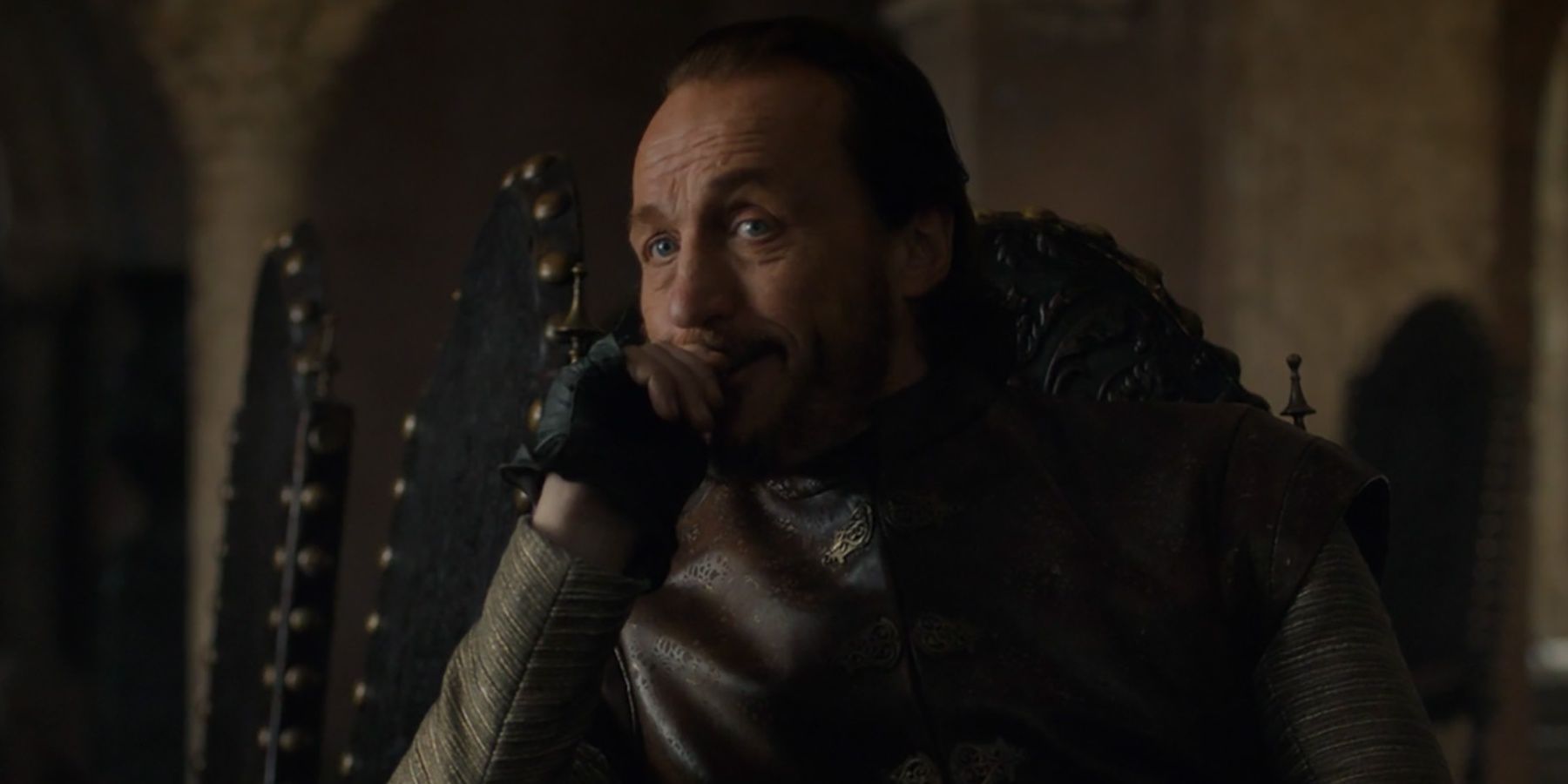 Bronn sits in a chair during a meeting with the King's Small Council