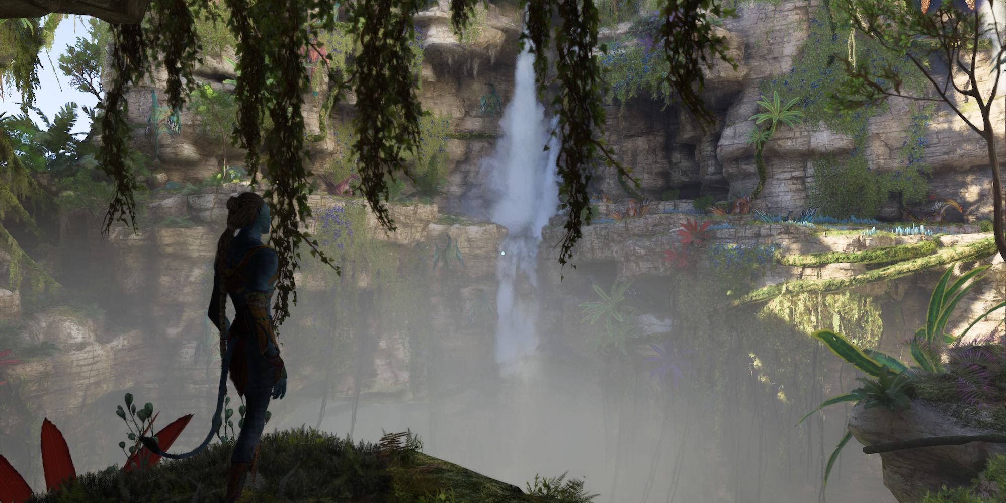 Na'vi looking at a waterfall standing at the edge of a cliff in Avatar: The Frontiers of Pandora