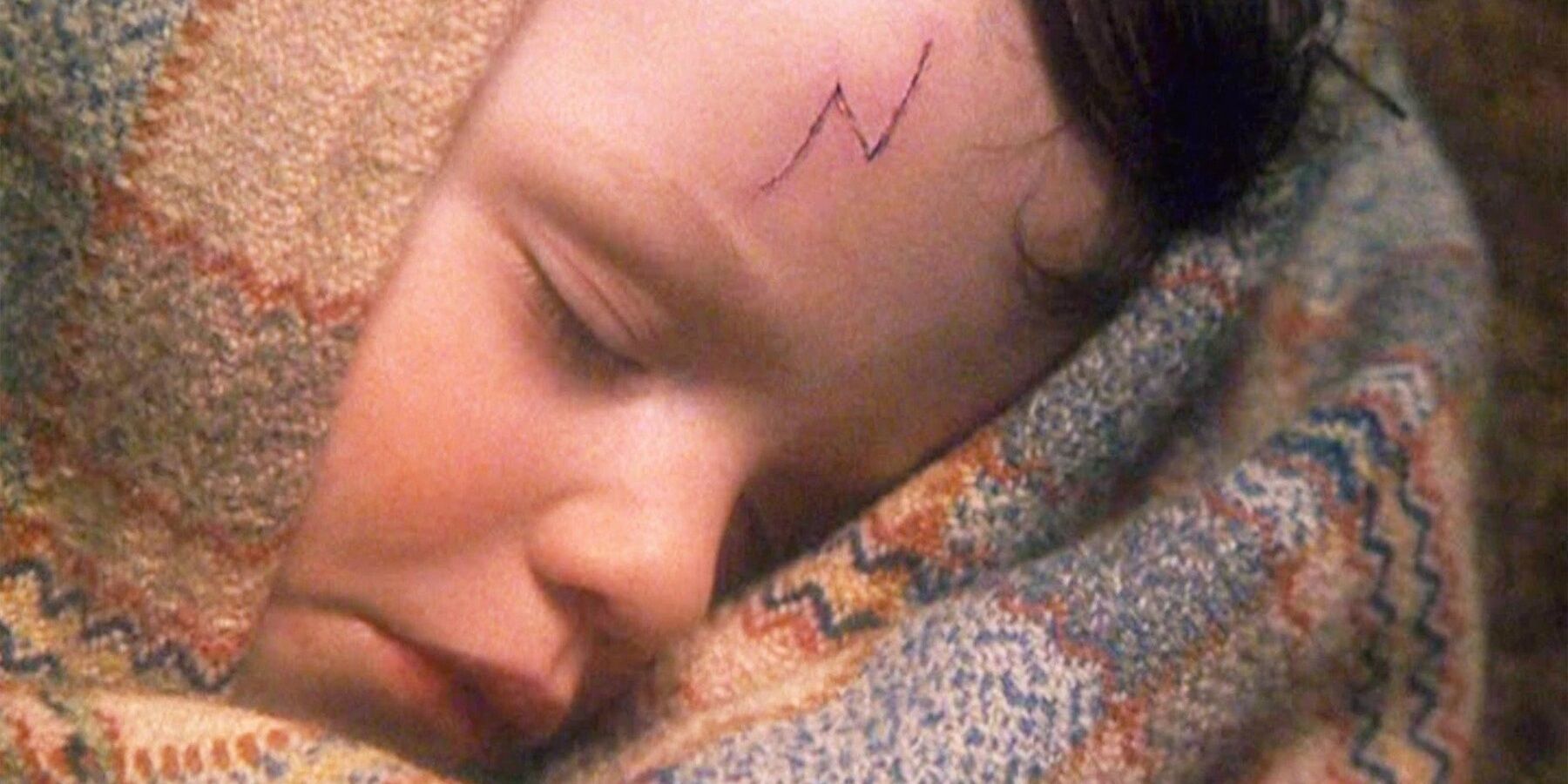 infant harry potter with a lightning bolt scar