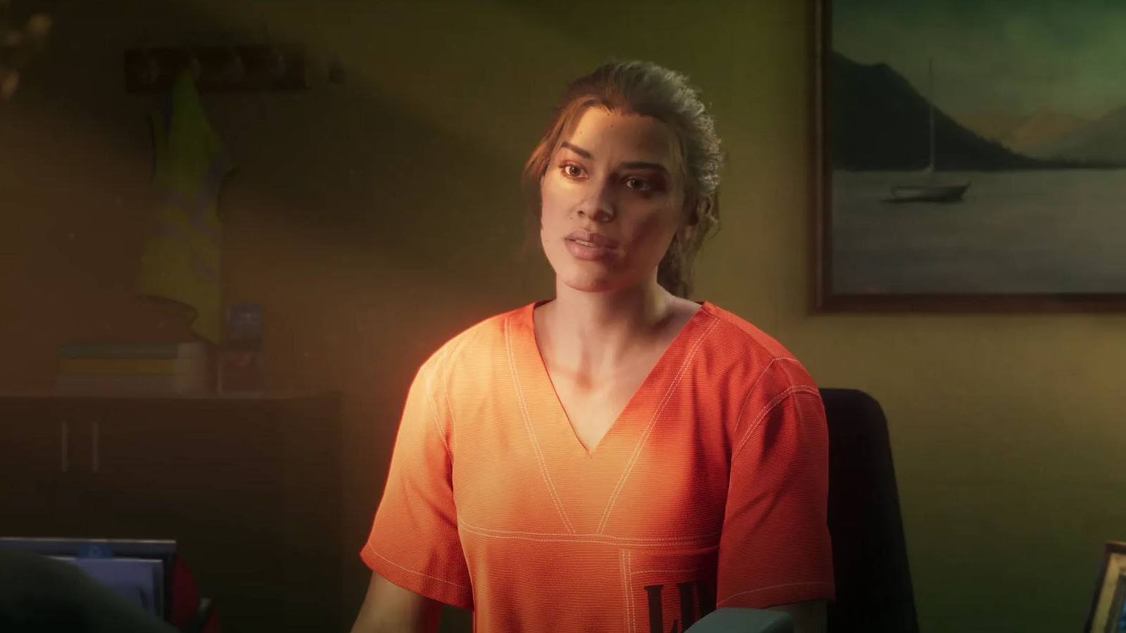 A screenshot of Grand Theft Auto 6 protagonist Lucia sitting in an office while wearing an orange prison uniform.