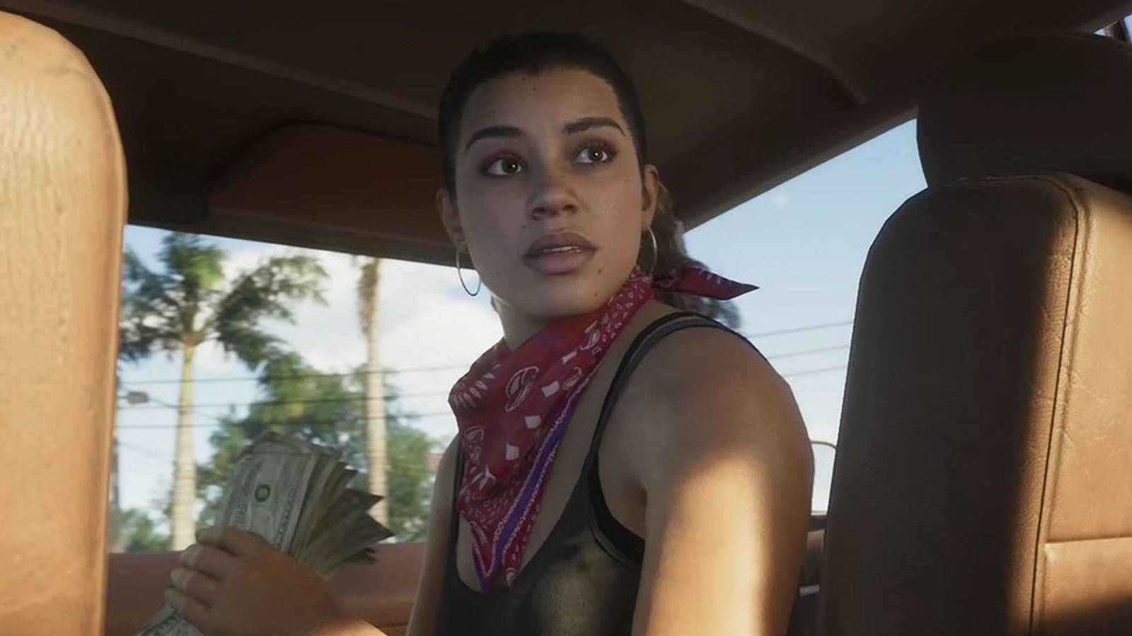 A screenshot of Lucia riding in the passenger seat of a car in Grand Theft Auto 6.