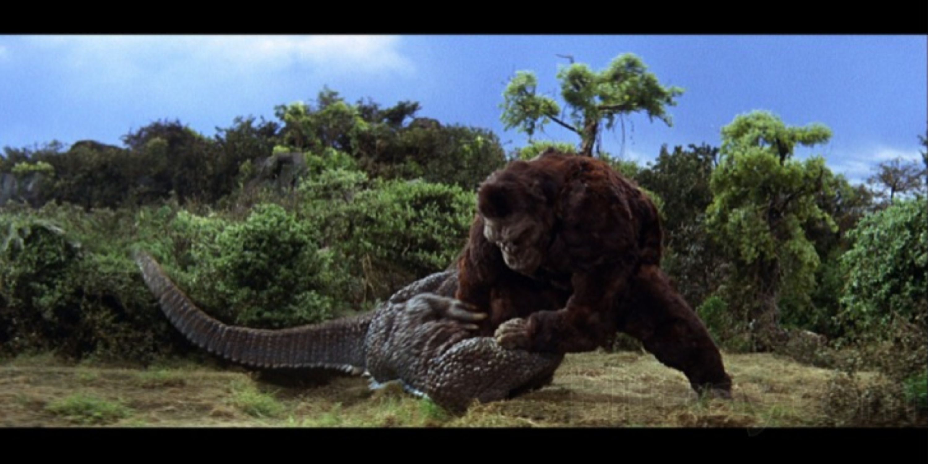 King Kong slams a Gorosaurus to the ground