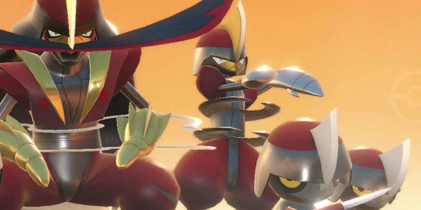 Kingambit, Bisharp, and two Pawniard posing