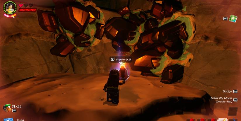 Image of a character standing in front of some copper in Lego Fortnite