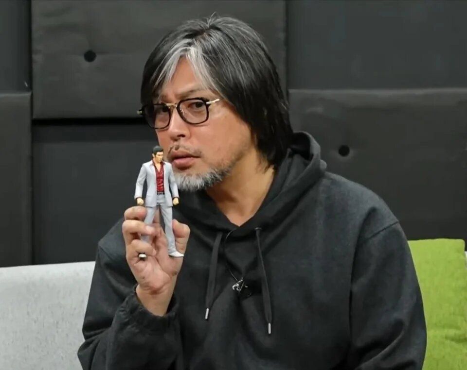 masayoshi-yokoyama-holding-kiryu-figurine