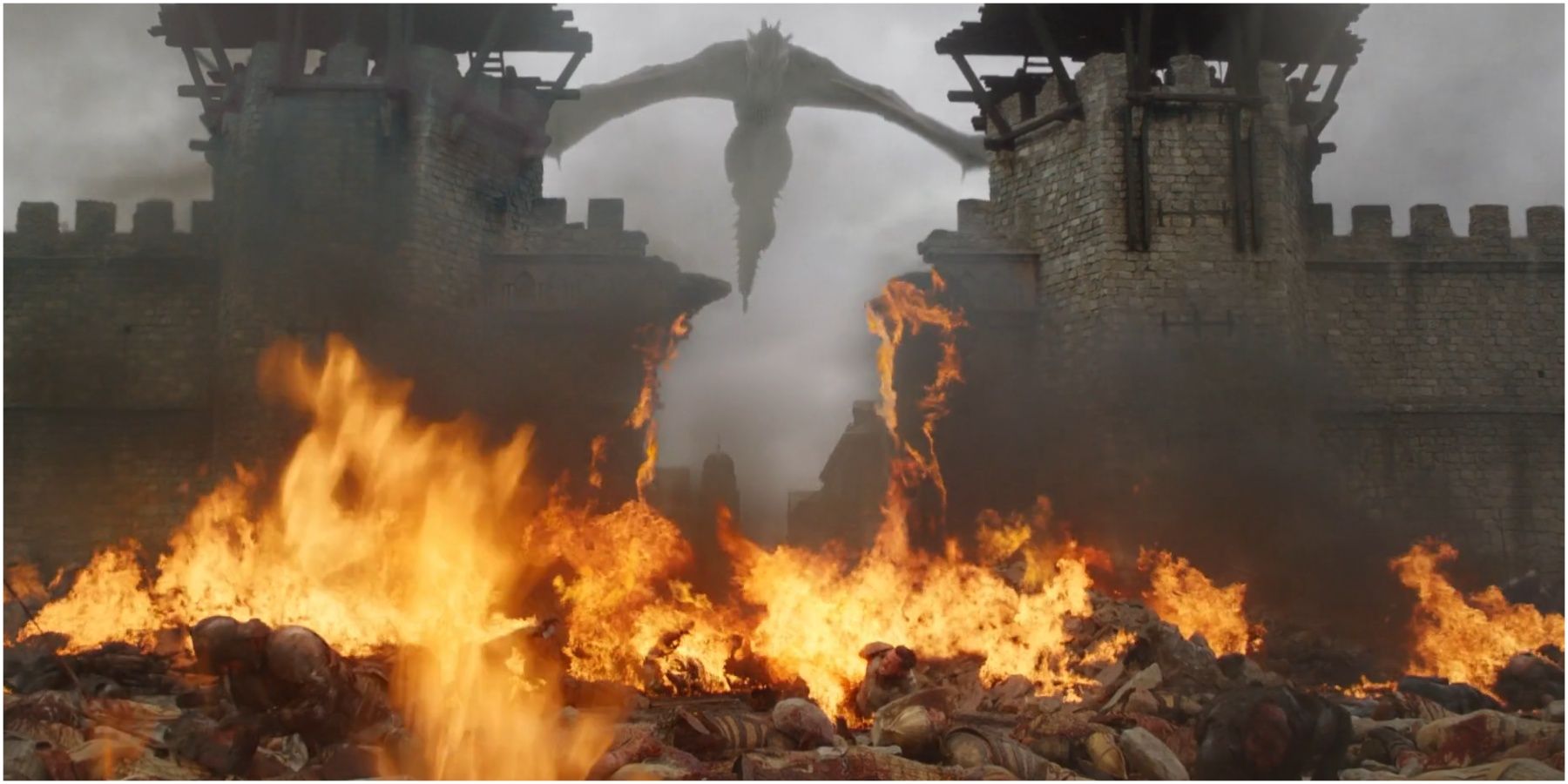 Drogon burns the city gates in Game of Thrones.