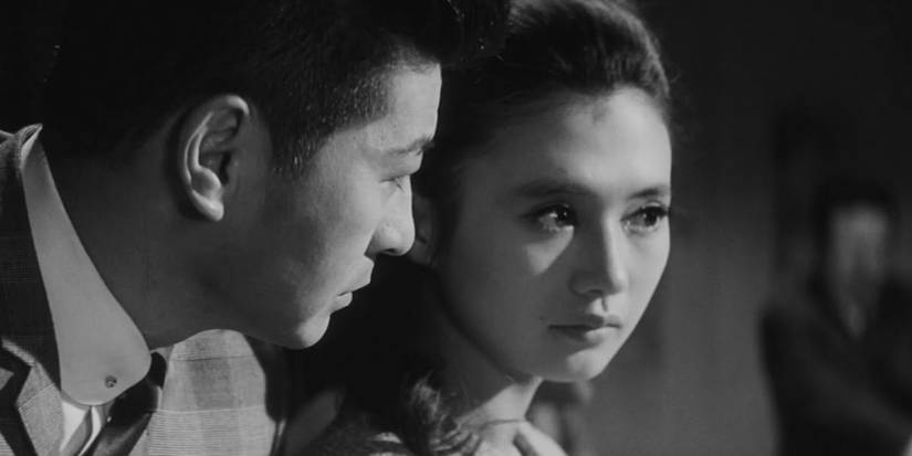 Man and woman looking serious