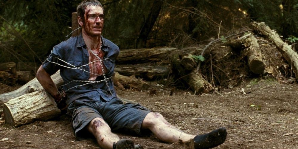 Michael Fassbender tied up and bloody