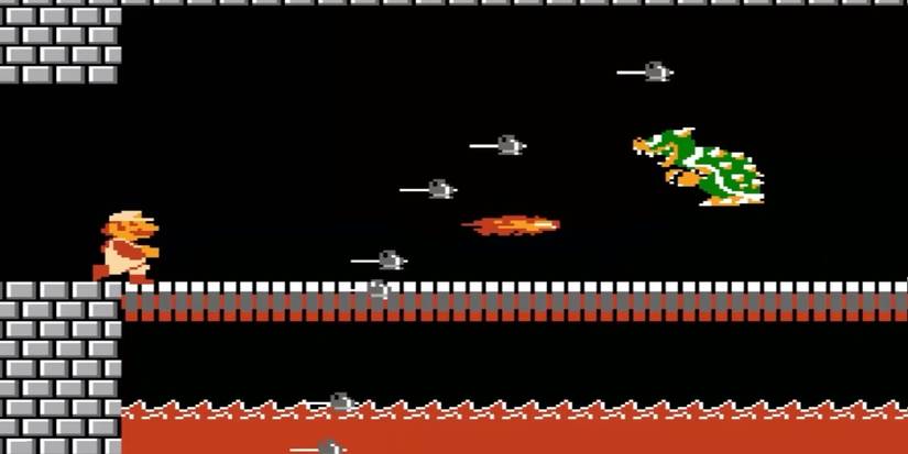 mario fighting bowser in super mario bros