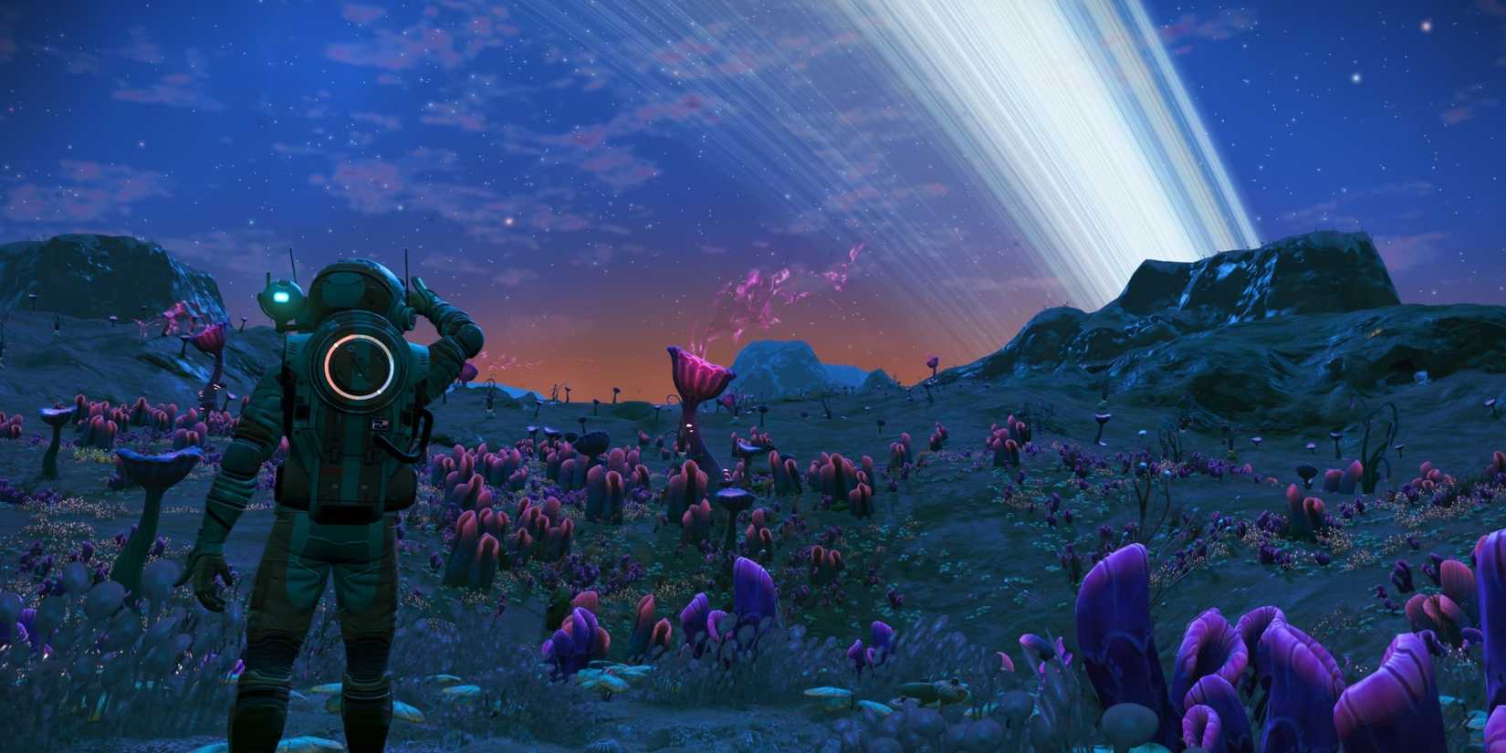 An astronaut looking over a dark planet