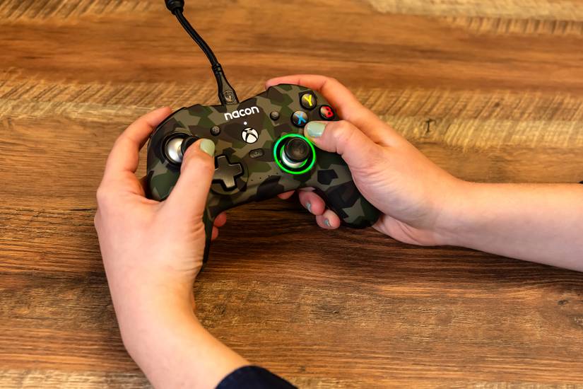 person-holding-the-nacon-revolution-x-controller-field-camo-3jpg_53333822896_o
