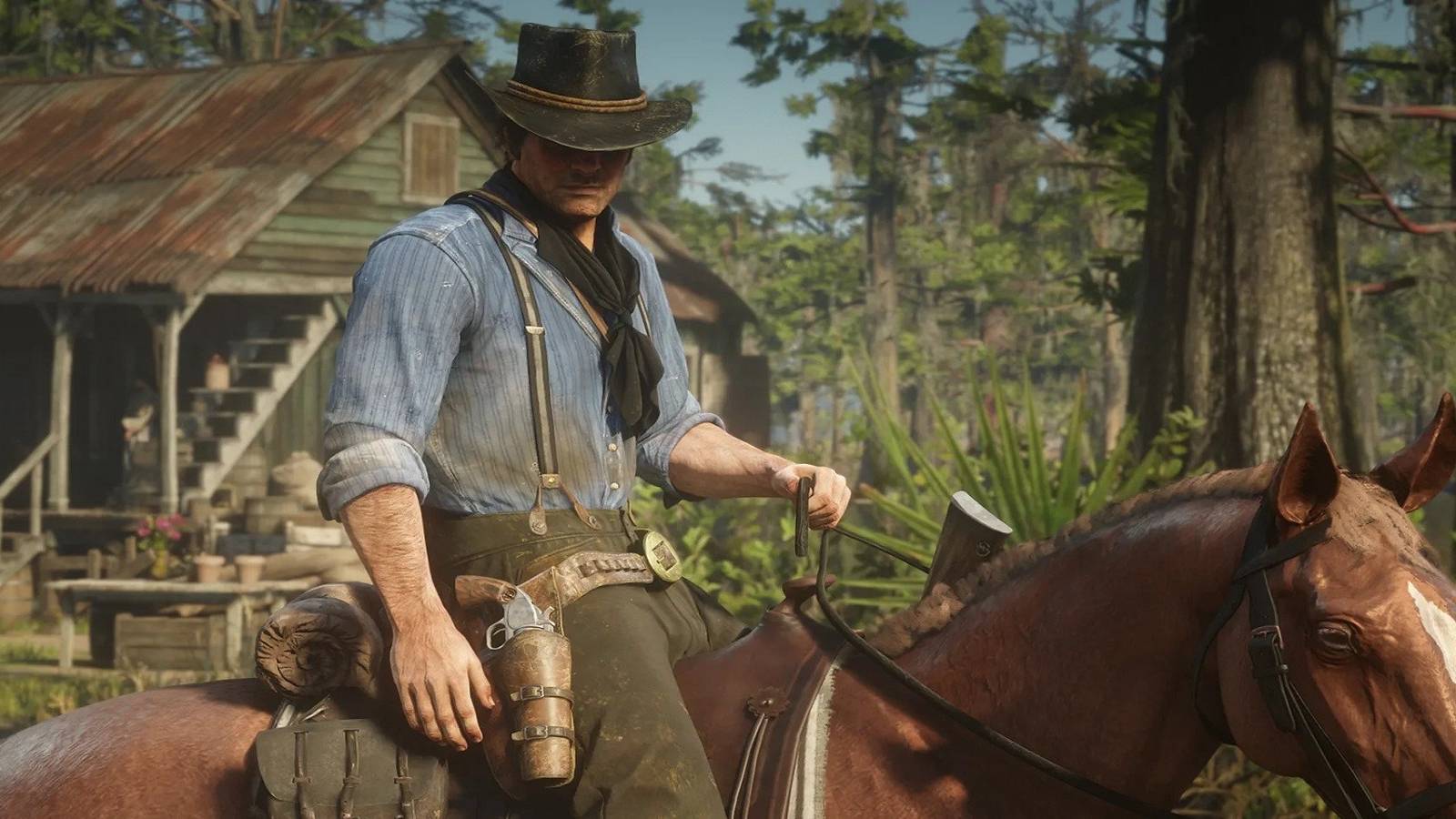 arthur morgan sits on a horse in red dead redemption 2