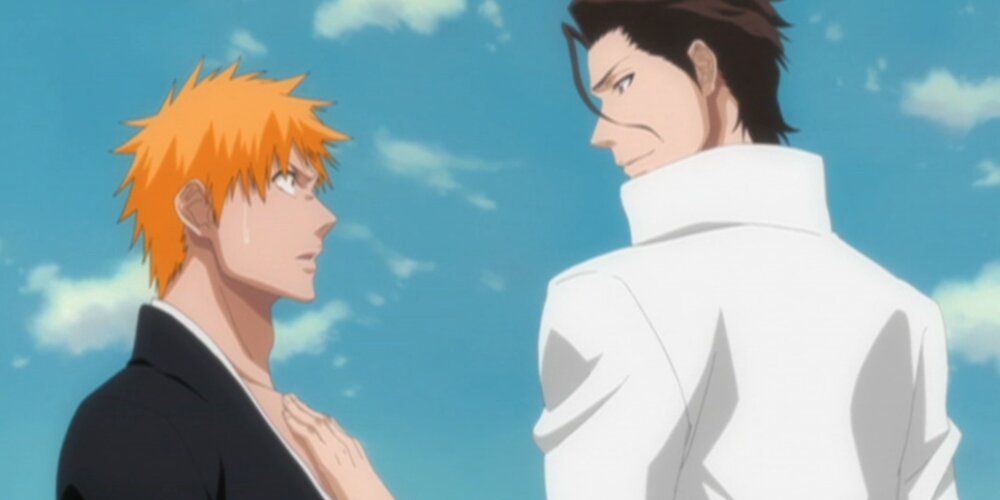 Aizen holding his hand on Ichigo's chest