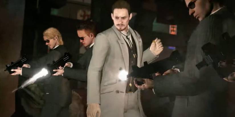 Simmons standing next to his guards who are firing uzi SMGs