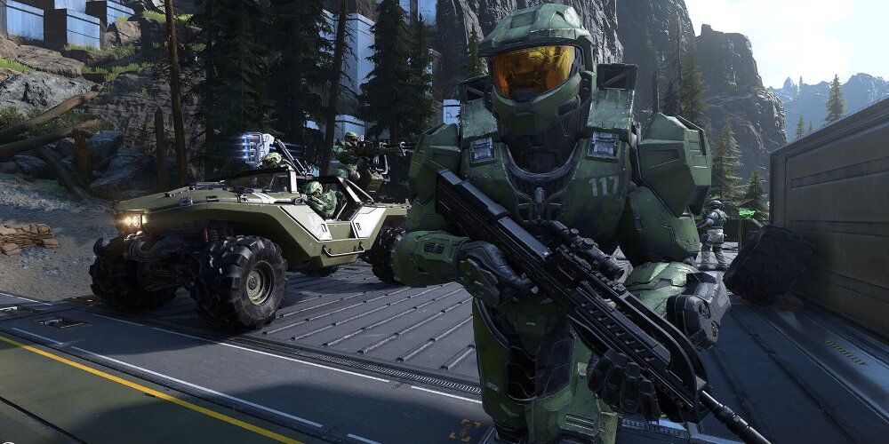 Master Chief standing in front of a Warthog
