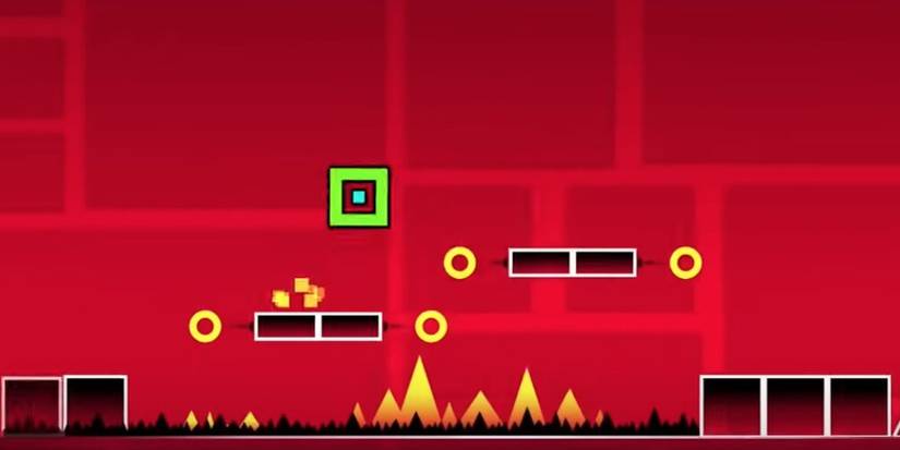 Green cube jumping over 2 platforms hovering over spikes 