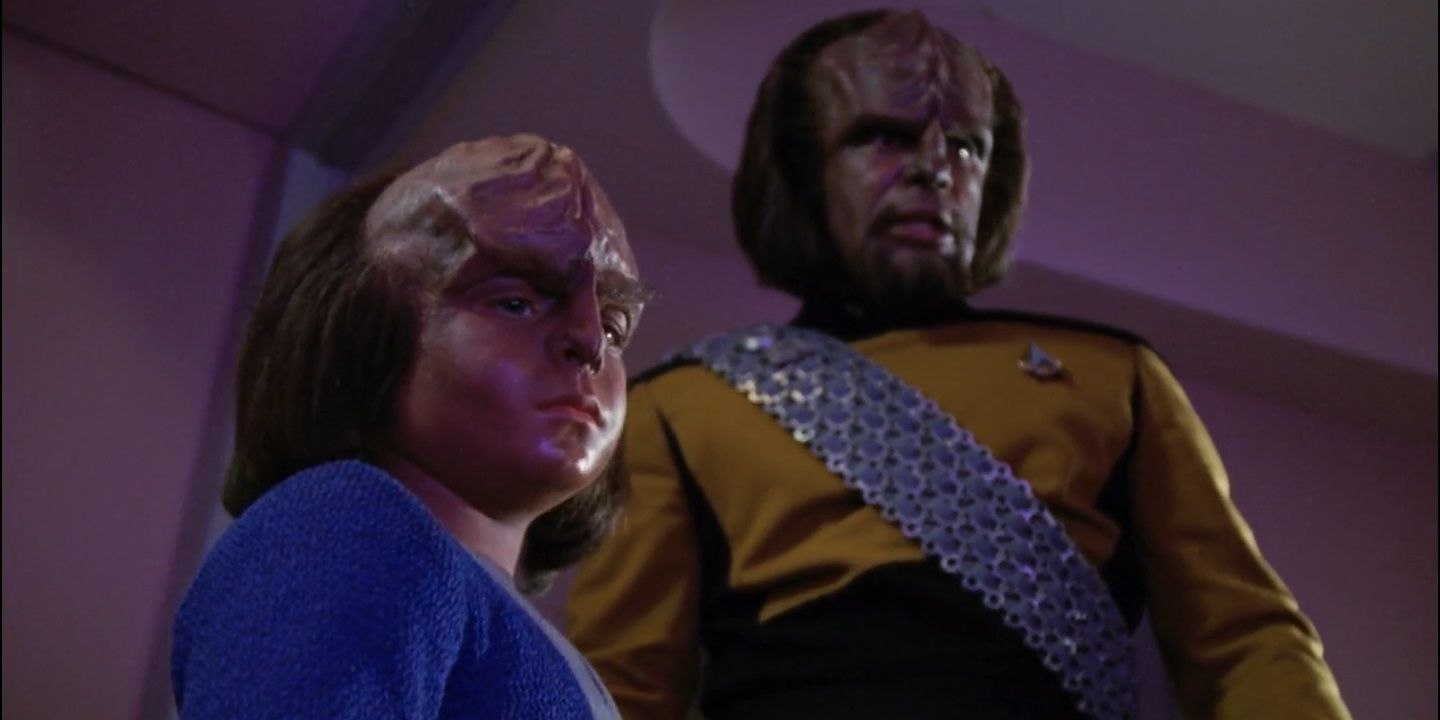 Alexander and Worf look upon a body in Star Trek: The Next Generation.