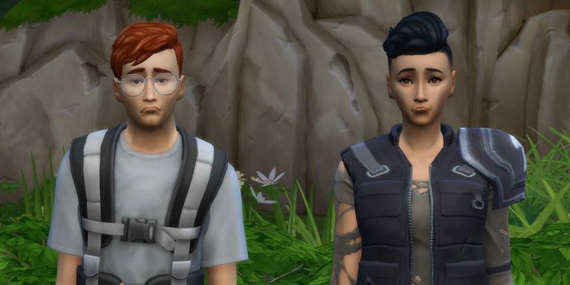Two Sims side-by-side are frowning because they have just been reaped as tributes for The Hunger Games in the legacy challenge for The Sims 4.