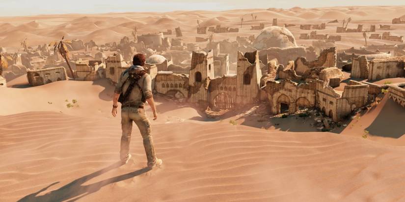 Nathan drake looks upon a desert settlement in unchartered 3