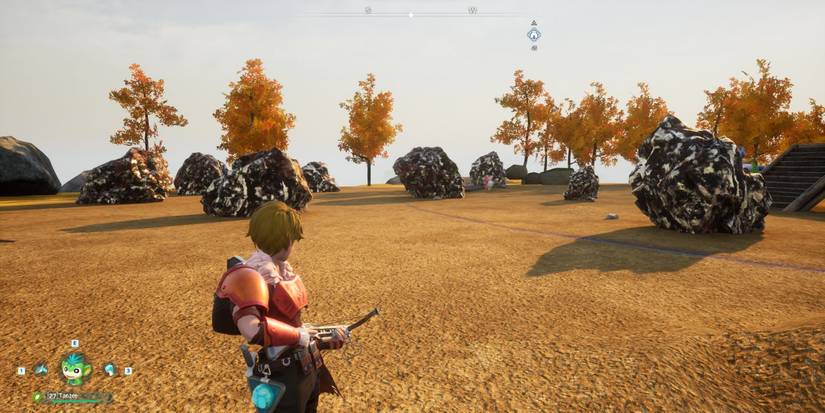 Pal tamer standing near ore nodes in Palworld