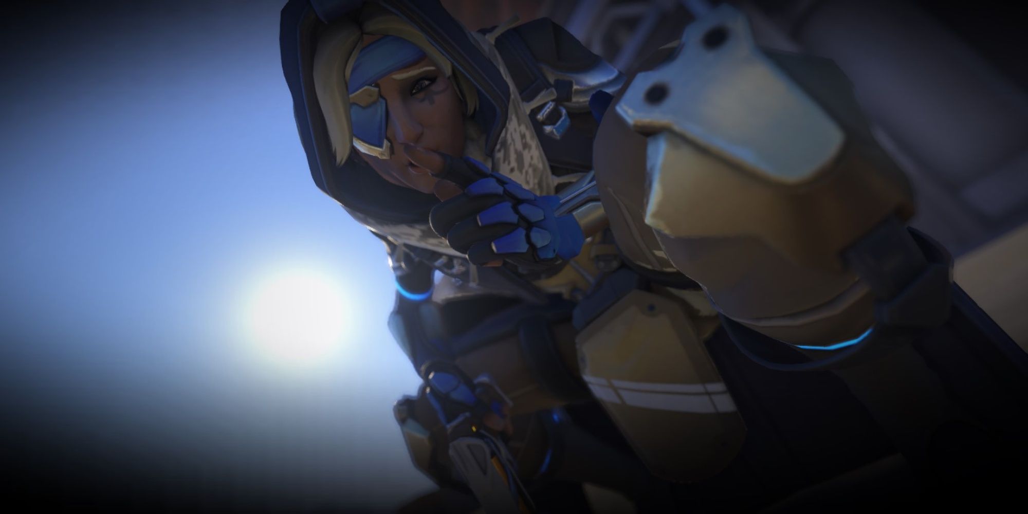 Ana from Overwatch 2 puts a finger to her lips as the viewer falls asleep.