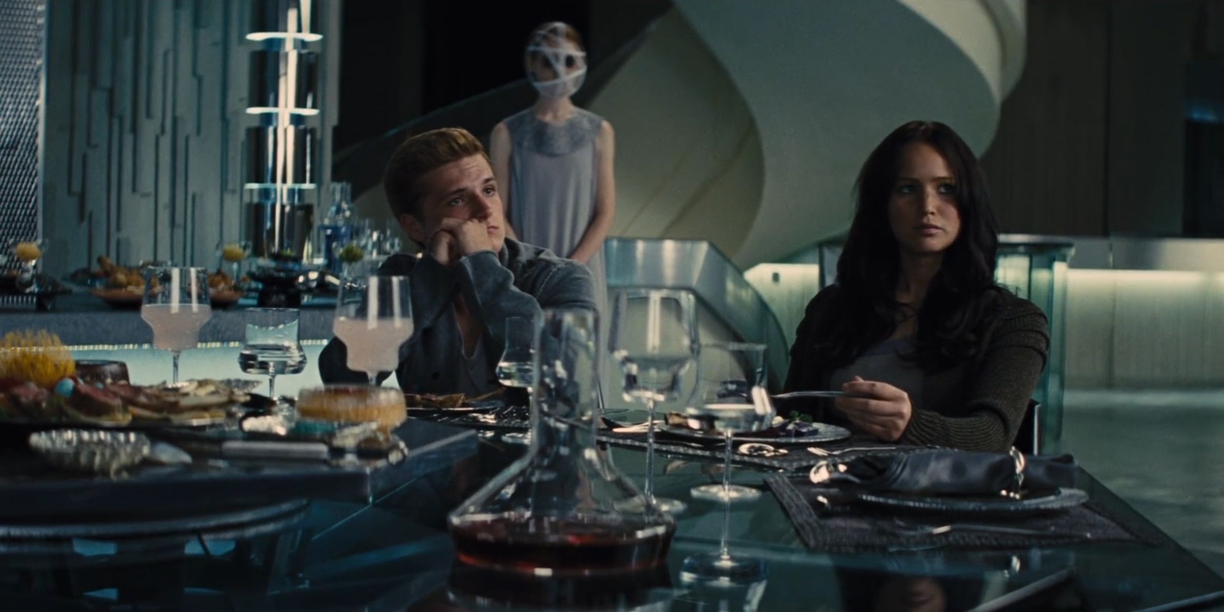 Avox in the background in The Hunger Games: Catching Fire