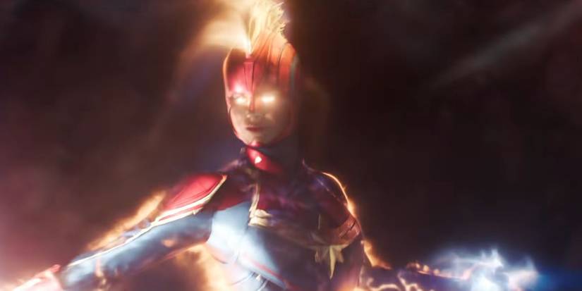Captain Marvel flying through space with her mask on