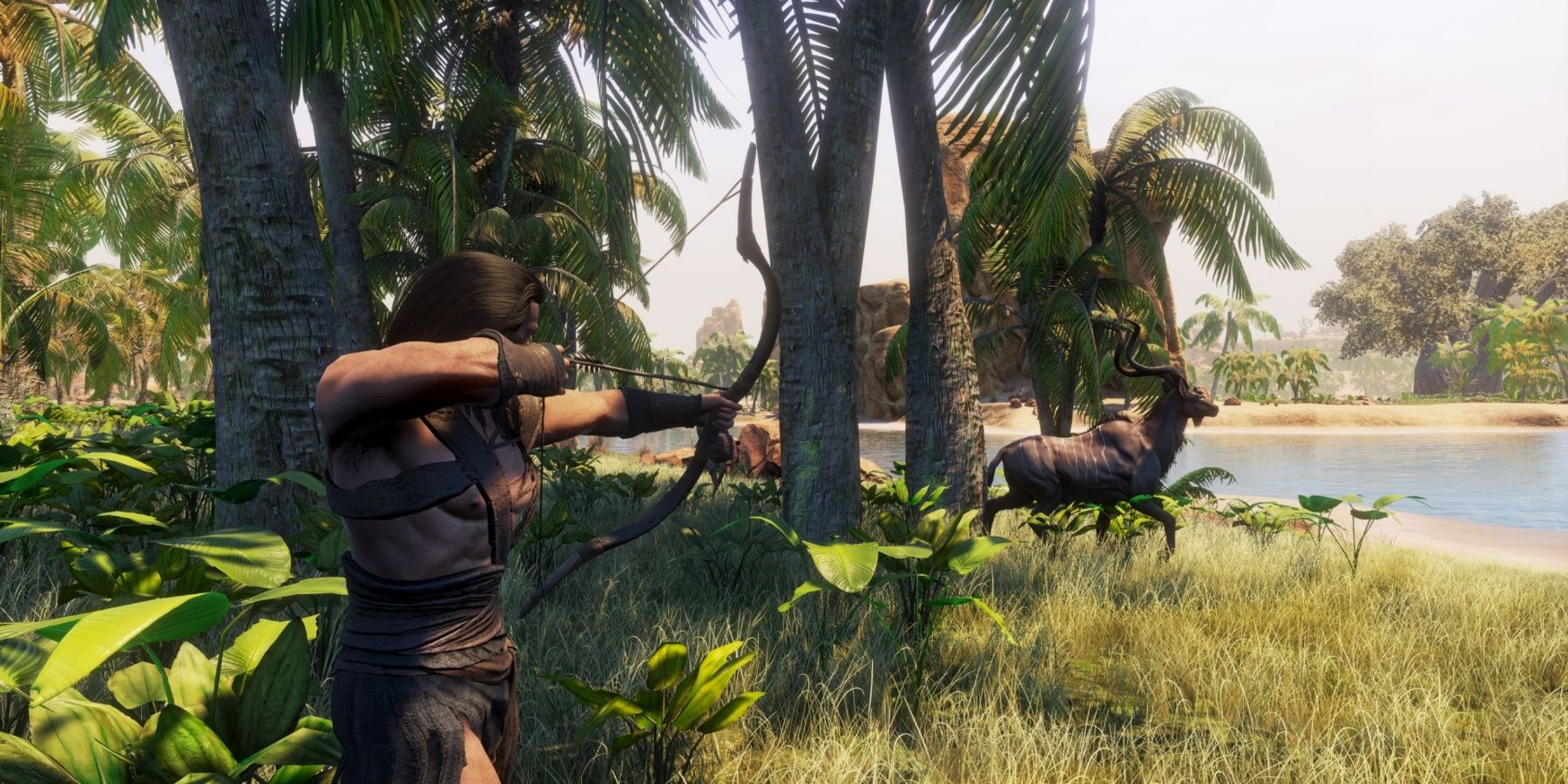 A man aiming a bow at a deer as it prances towards the beach in Conan Exiles