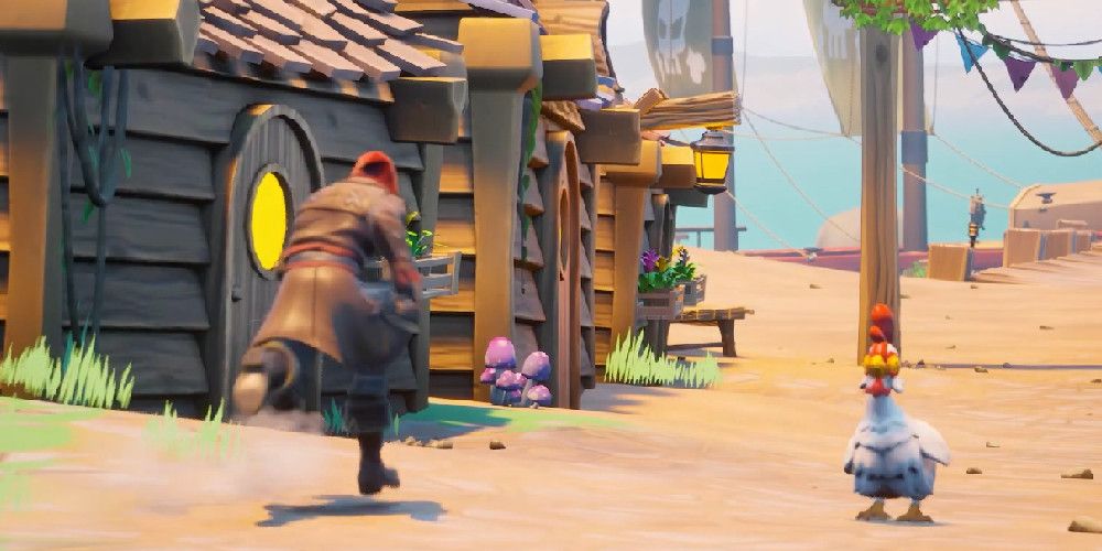 A Fortnite character in a long, brown jacket running by a chicken in a village on a sandy island. Image source: 3DLab on YouTube. 